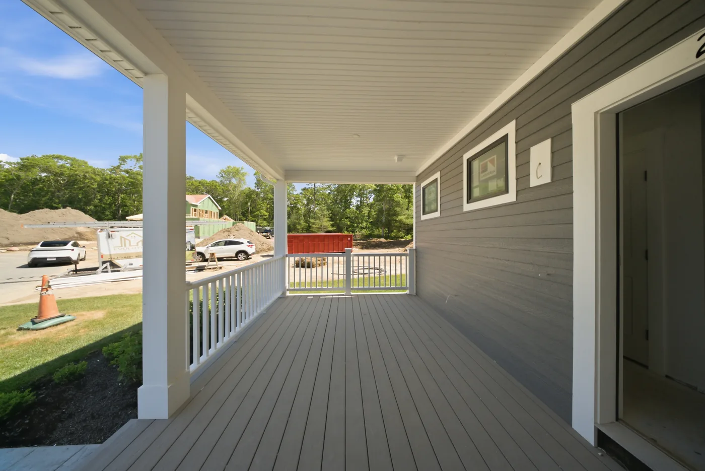Deck builder on the South Shore: a covered porch framed and finished where it meets the house