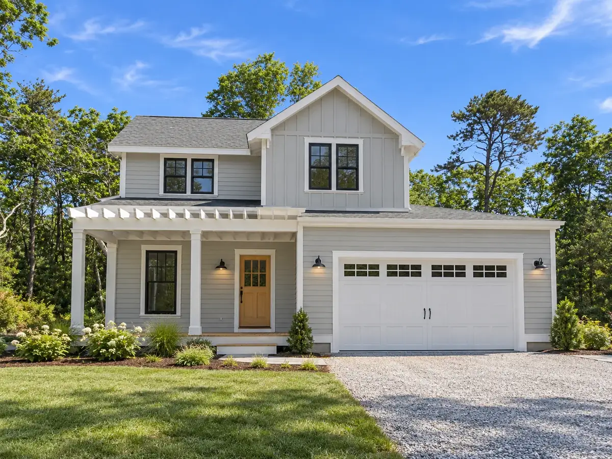 New construction on the South Shore: a cape with an attached two-car garage