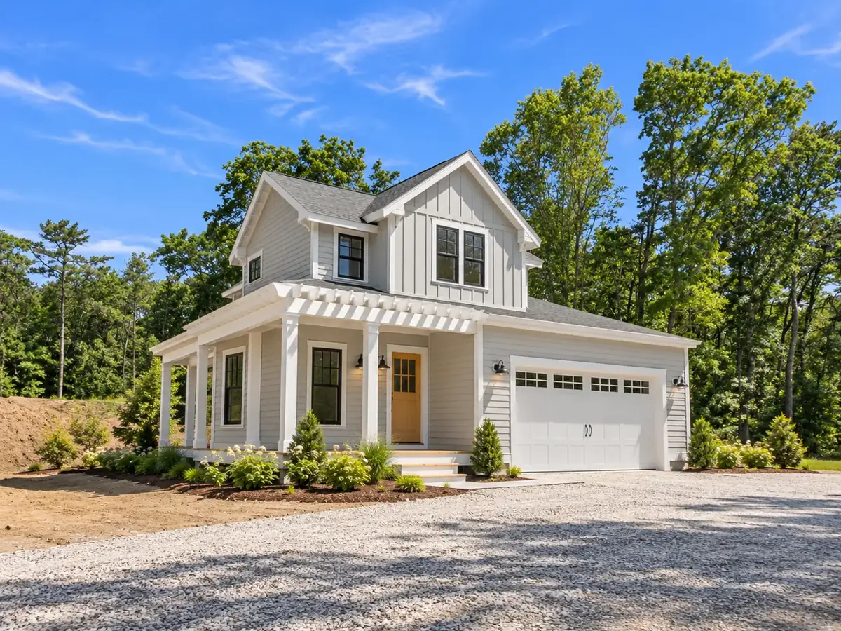 New construction on the South Shore with a pergola over the entry