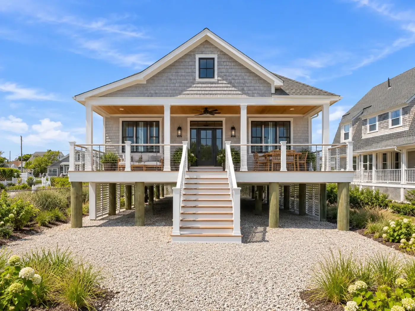 New construction on the South Shore: a house raised on pilings to meet flood zone elevation
