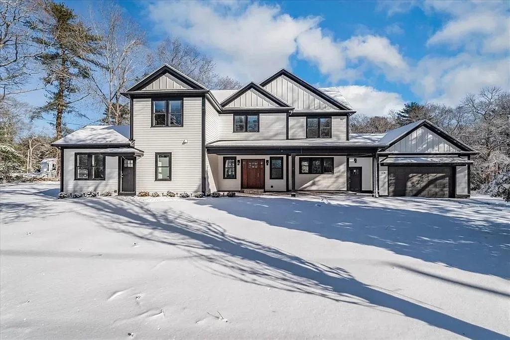 New construction on the South Shore photographed in winter, modern farmhouse
