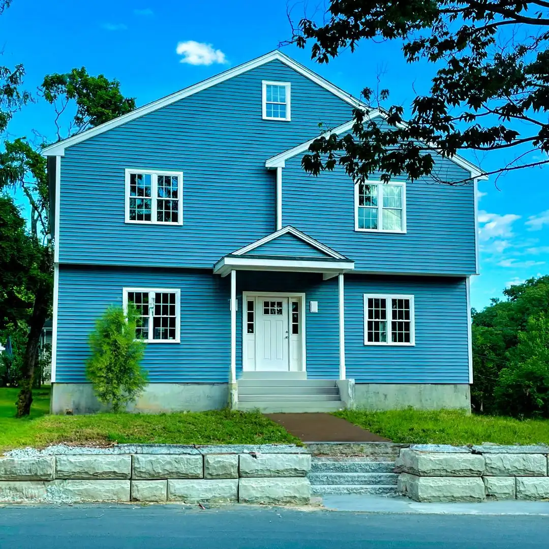 Blue lap siding and white trim on a South Shore home