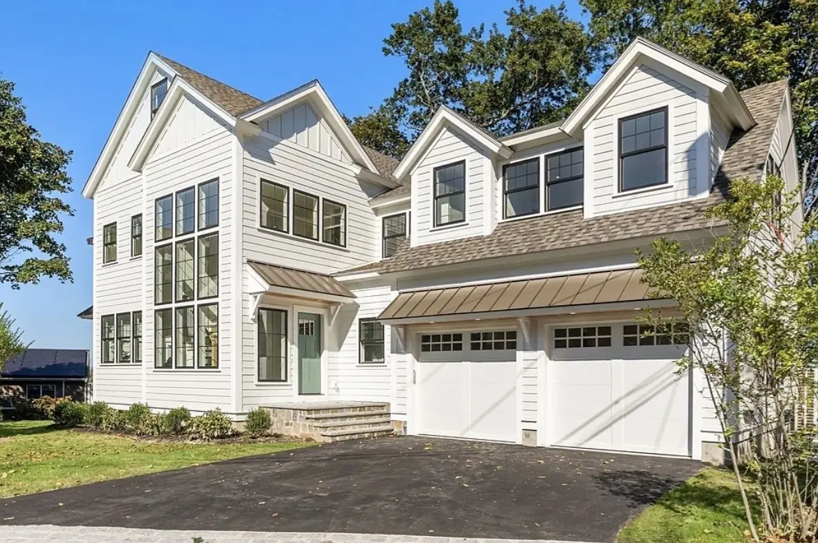 White lap siding and trimmed window casing on a South Shore home